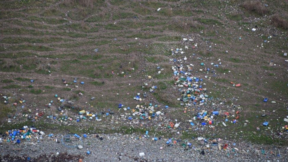 Fishboxes, traffic cones, plastic pipes and barrels at Clanyard bay in south of Scotland