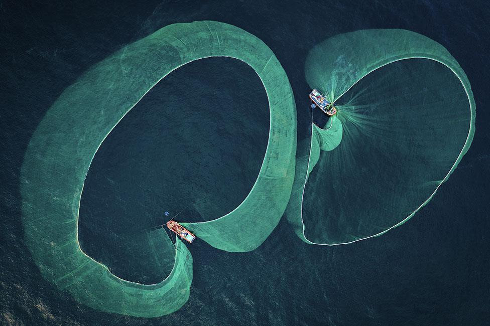 An aerial view of busy anchovy fishing activities off the coast of Hon Yen, Phu Yen province, Vietnam