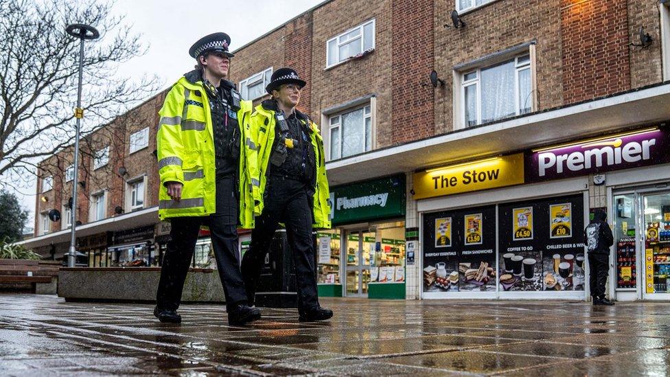 Two police officers patrol in Harlow