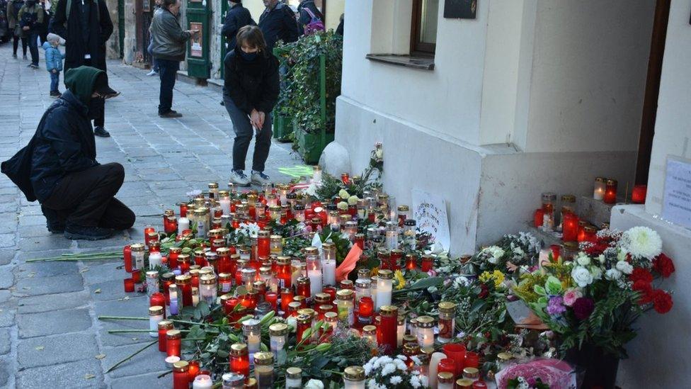 Flowers and candles are placed during a commemorative ceremony held on 5 Nov 2020 for four people killed in a terror attack in Vienna