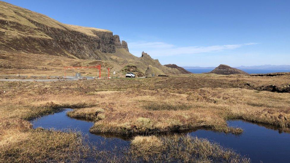 A single car parked at the Quiraing