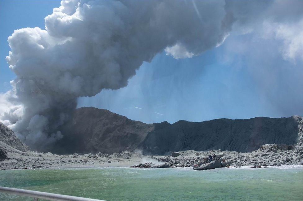 Whakaari, also known as White Island, New Zealand, spews steam and ash following an eruption on 9 December 2019