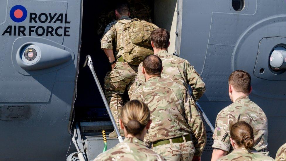 Military personnel board an RAF aircraft