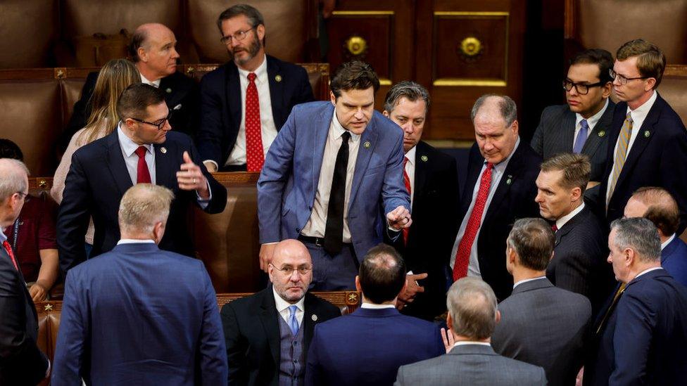 Matt Gaetz gestures to lawmakers on Wednesday