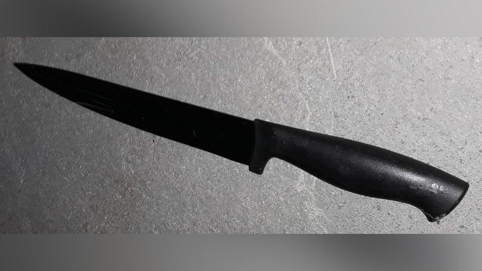 A black kitchen knife