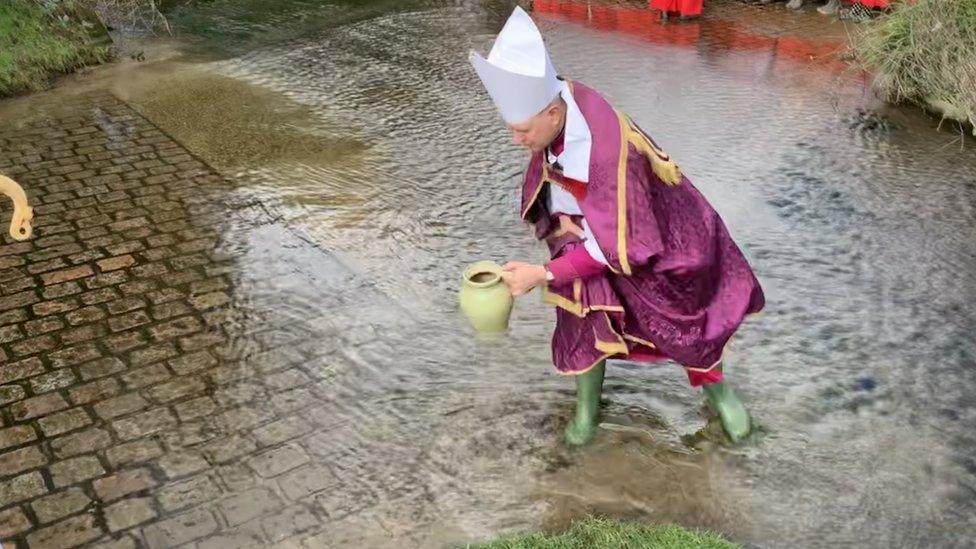 Bishop Martin Seeley taking water from Kersey ford.