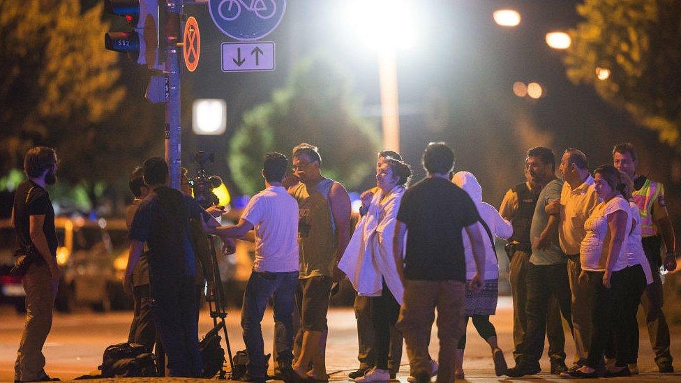 Anxious relatives gather at the scene of the shooting. 23 July 2016