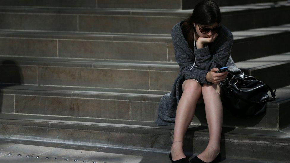 Commuter waits for a train