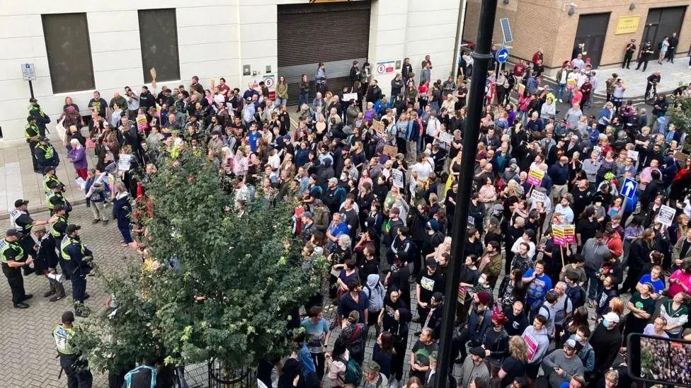 View of large crowd of counter-protesters gathered on a street in Southampton