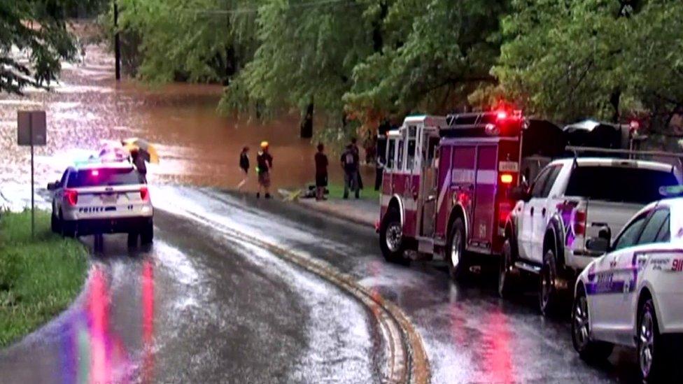 Image shows emergency crews at a flooded area in Lynchburg, Virginia