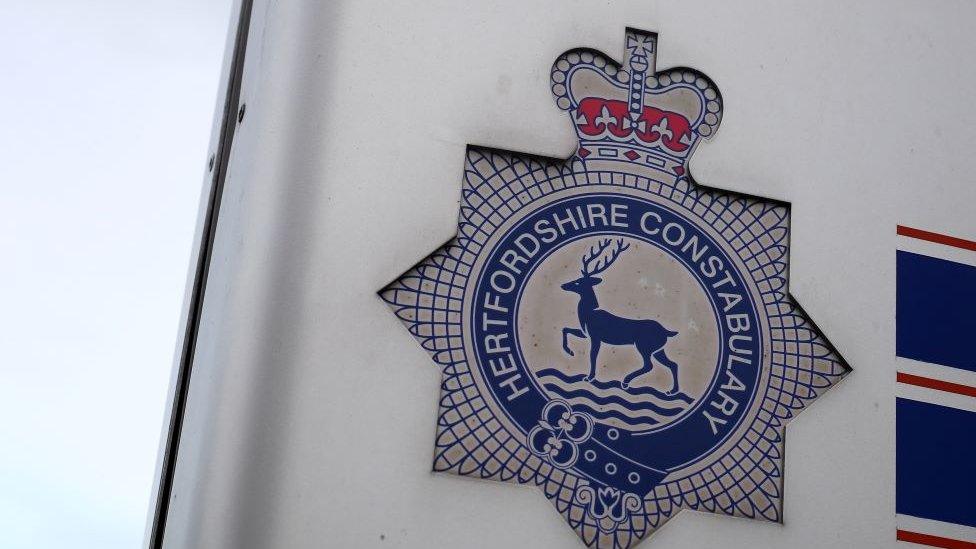 Hertfordshire Constabulary insignia on a sign.