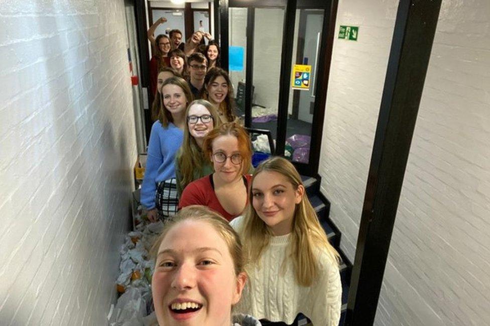 The 13 students lined up in the corridor of their university accommodation