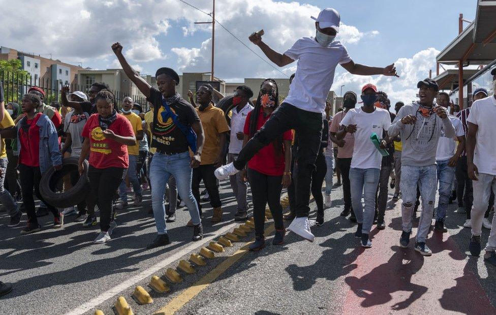 Students block Johannesburg roads in protest over university fees on March 15, 2021. Students took to the streets of Johannesburg early on Monday to continue their protests about fees as 26 universities across SA braced for a national shutdown. Students, countrywide, demonstrated demanding that those who are in debt be allowed to register and that historical debt be wiped out.