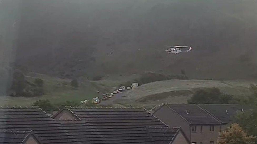 Helicopter and emergency vehicles at Arthur's Seat