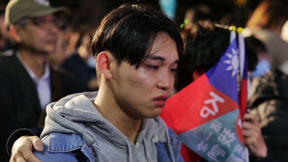 Supporters of Taiwan People's Party (TPP) presidential candidate Ko Wen-je react as they wait for results in the presidential election at the TPP headquarters in Xinzhuang in New Taipei City on January 13, 2024.