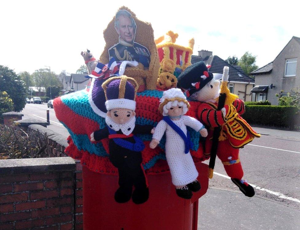 postbox topped with knitted King Charles, Queen Camilla and beefeater