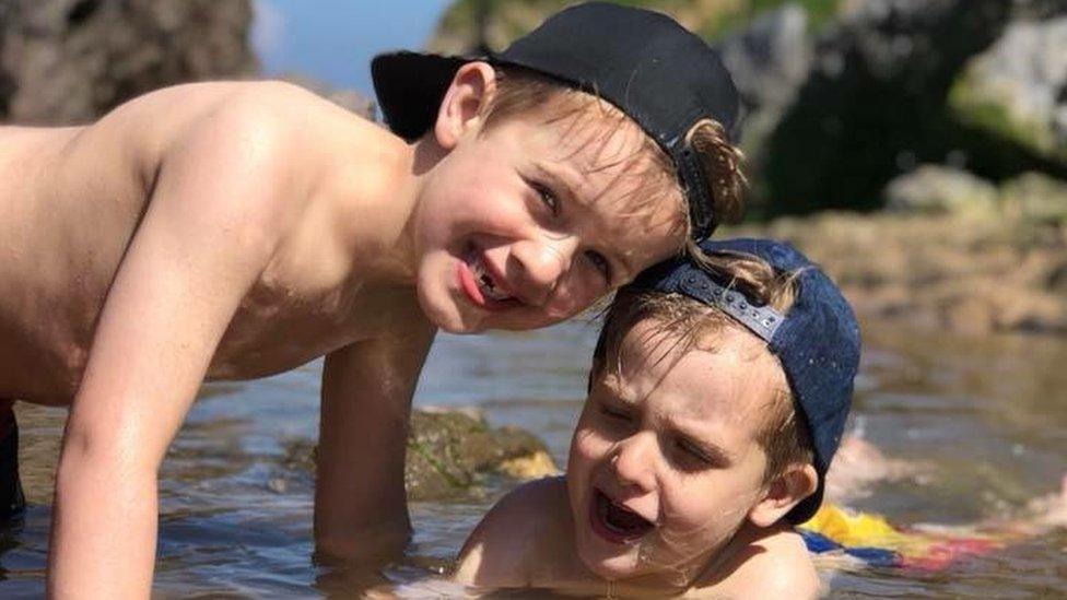 Marley and his brother George in the sea