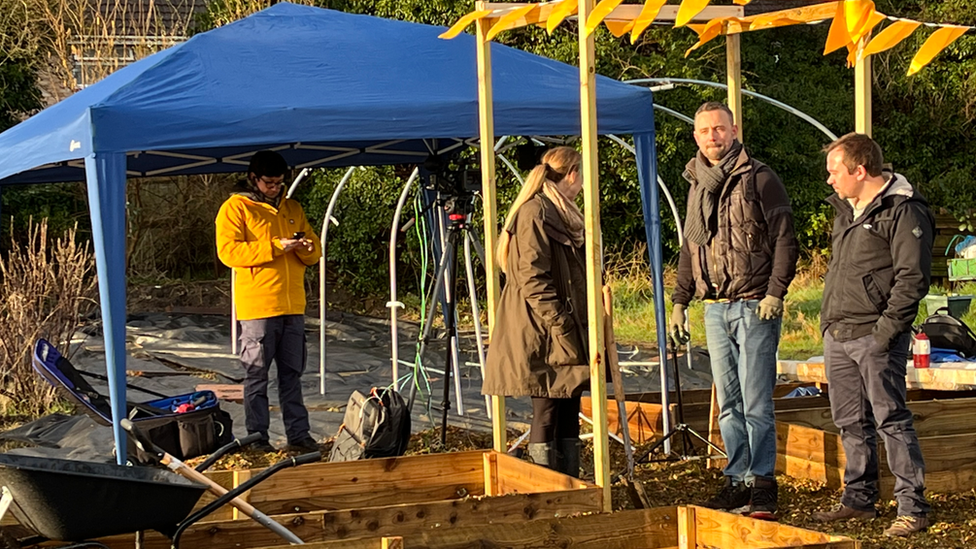 People standing in an allotment