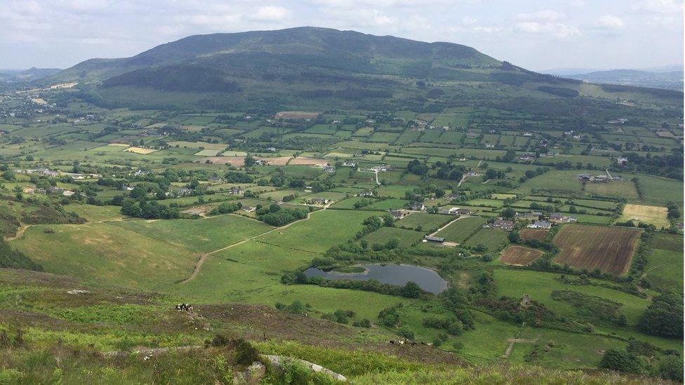 Green fields with hills in the distance