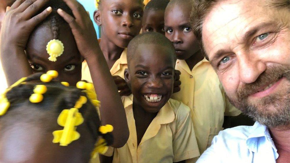 Gerard Butler and children in Haiti