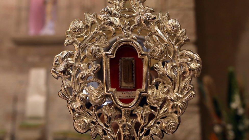 A fragment of a wooden relic, reputed to be from Jesus' manger, is displayed in Jerusalem ahead of its transfer to Bethlehem, on 29 November, 2019.