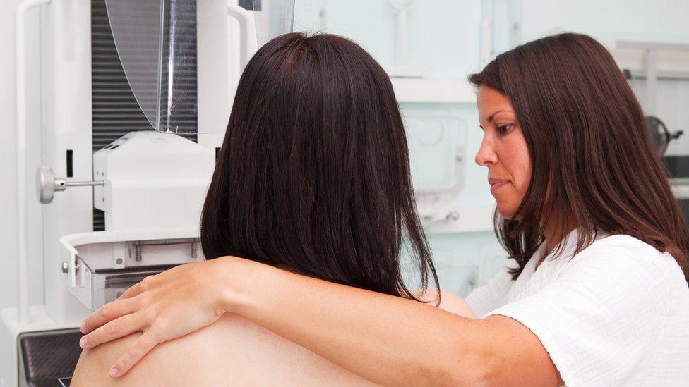 nurse with young women having a mammogram