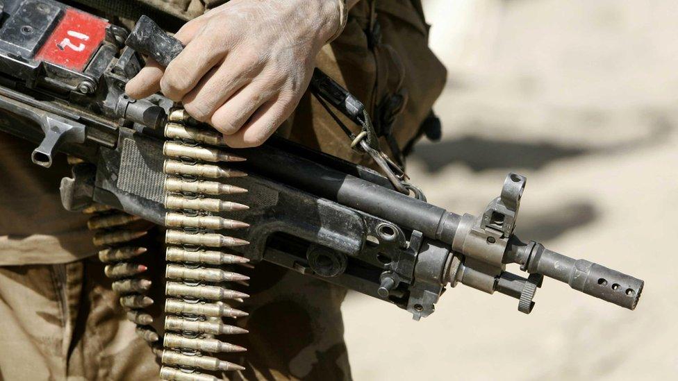 British Soldier on patrol in the green zone in the Helmand province, Southern Afghanistan