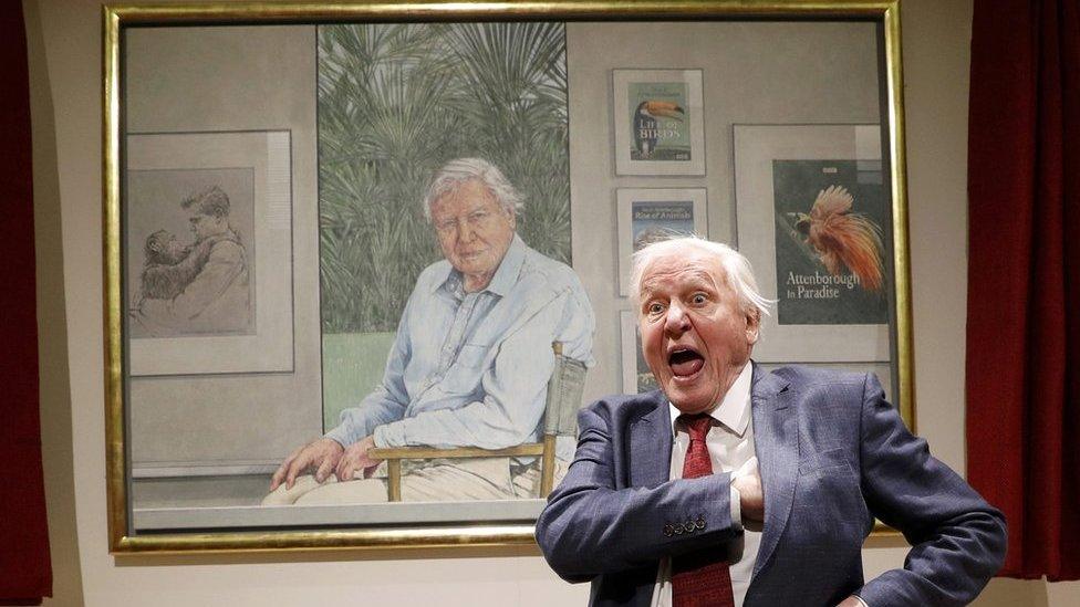 Sir David Attenborough in front of his portrait