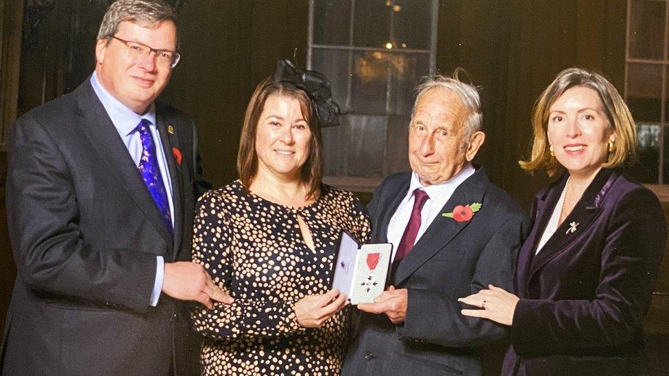 Mr Stubbs (centre right) with his MBE