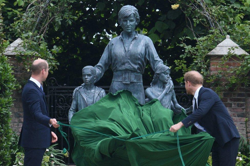 Prince William, Duke of Cambridge (L) and Britain's Prince Harry, Duke of Sussex unveil a statue of their mother, Princess Diana at The Sunken Garden in Kensington Palace