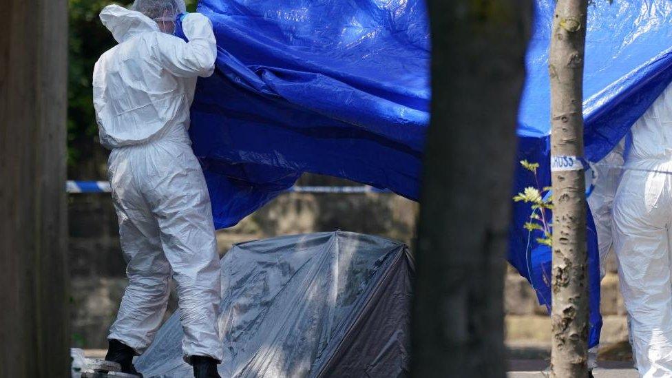 Forensic officers erecting a tent in Nottingham