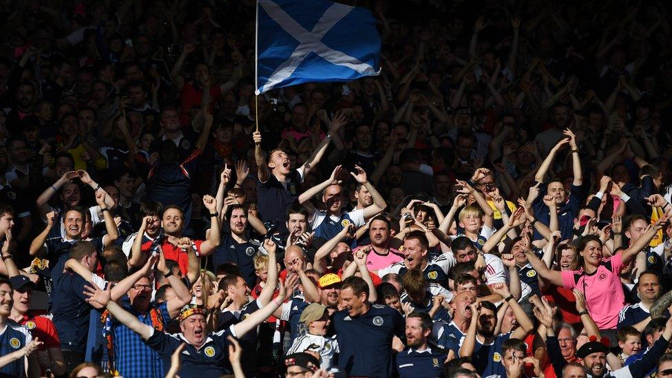 Scottish fans celebrate taking the lead during the FIFA 2018 World Cup Qualifier between Scotland and England at Hampden Park National Stadium