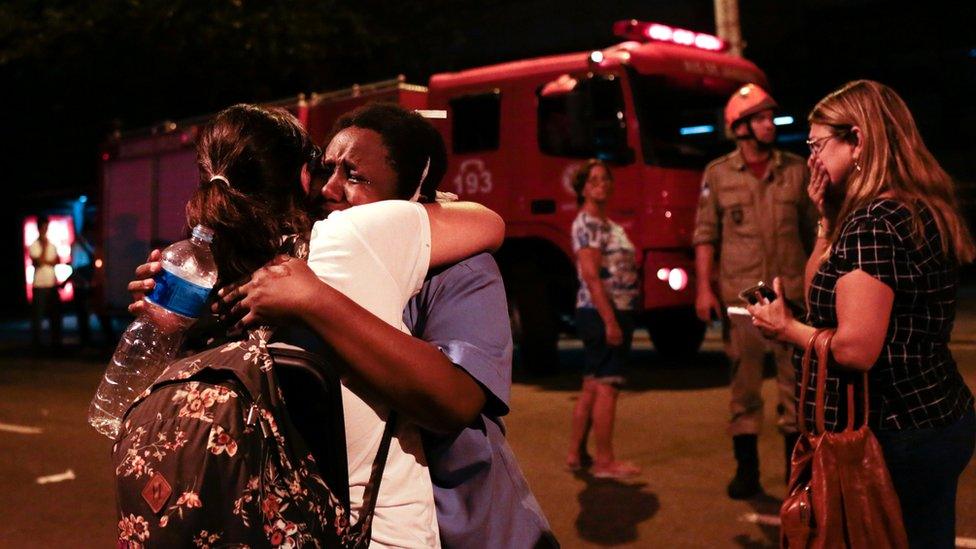 People react after a fire hit the Badim Hospital in Rio de Janeiro, Brazil September 12, 2019.