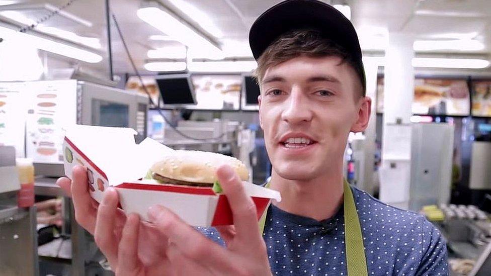 Doug Armstrong holding a burger