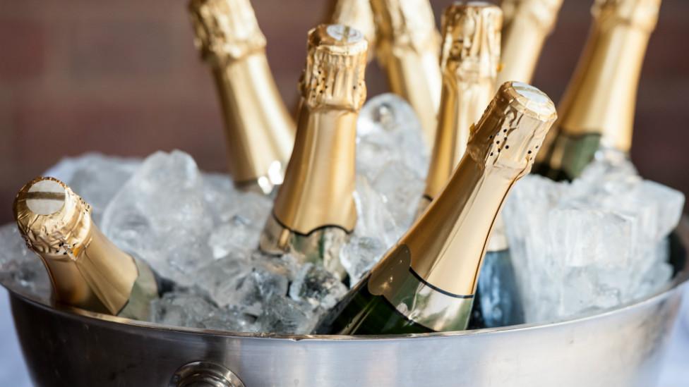 Champagne bottles in an ice bucket