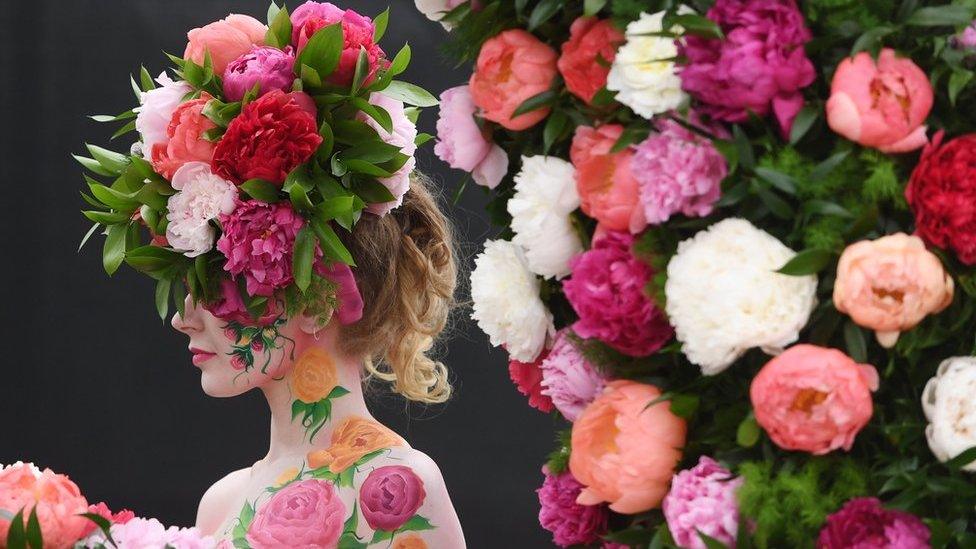 A model poses at Chelsea Flower Show