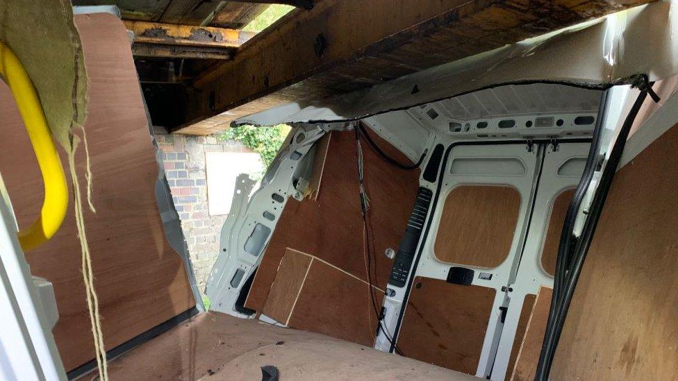 Van under bridge