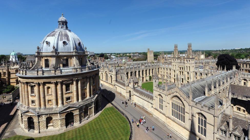 Oxford University, with the cupola dome of the Bodleian Library in the foreground, and the famous spires of the university buildings in the background.