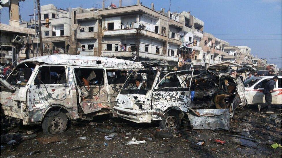 Images from Homs released by state media showed streets filled with debris and mangled cars