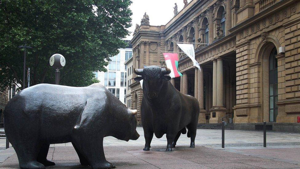 A bull and bear statue in front of the Deutsche Boerse (German stock exchange) in Frankfurt