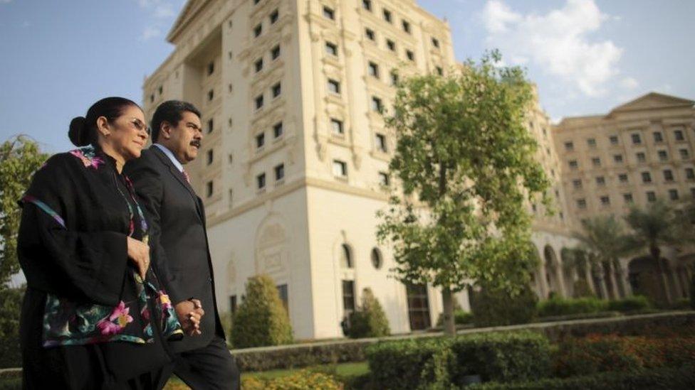 Venezuela's President Nicolas Maduro (right) holds hands with his wife Cilia Flores as they arrive for a meeting in the Summit of South American-Arab Countries, in Riyadh (11 November 2015)