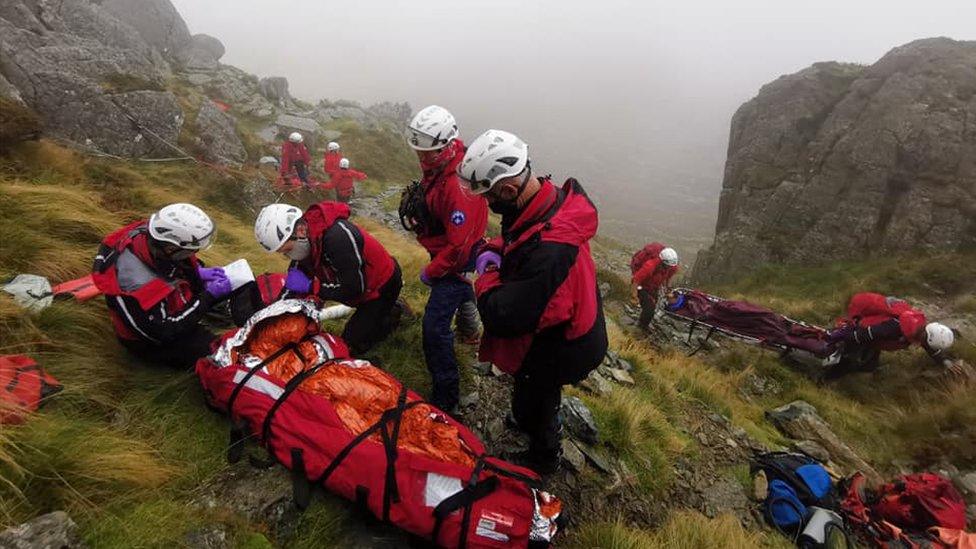 Sunday: Rescuers help a man seriously injured after falling on Tryfan