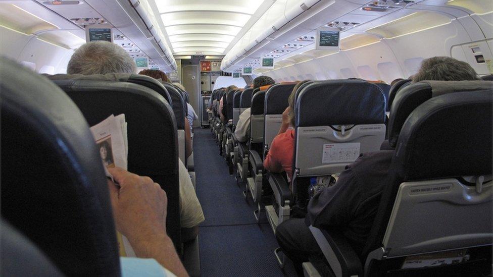 Interior of airplane with passengers