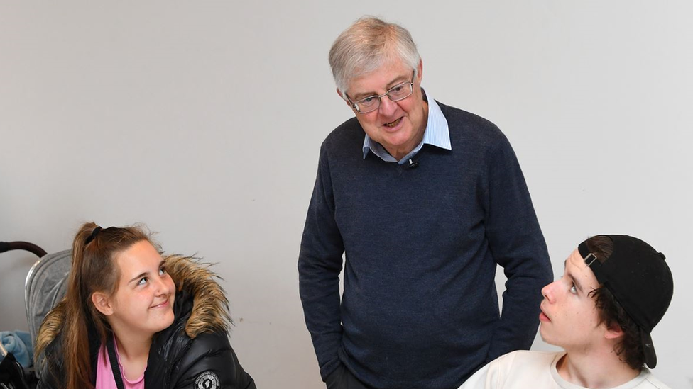 First Minister Mark Drakeford with care leavers