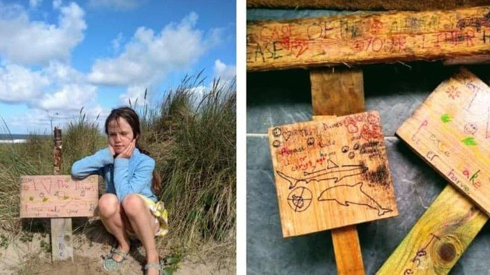 Girl with wooden signs