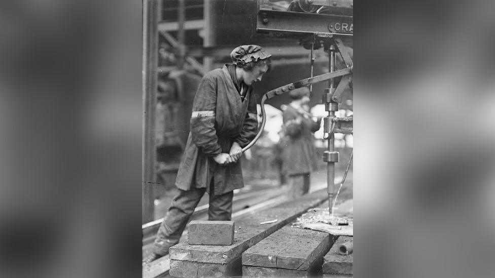 A female worker operating a magazine drilling plate at the shipbuilding yard of the Swan Hunter & Wigham Richardson Ltd, Wallsend, Tyne & Wear.