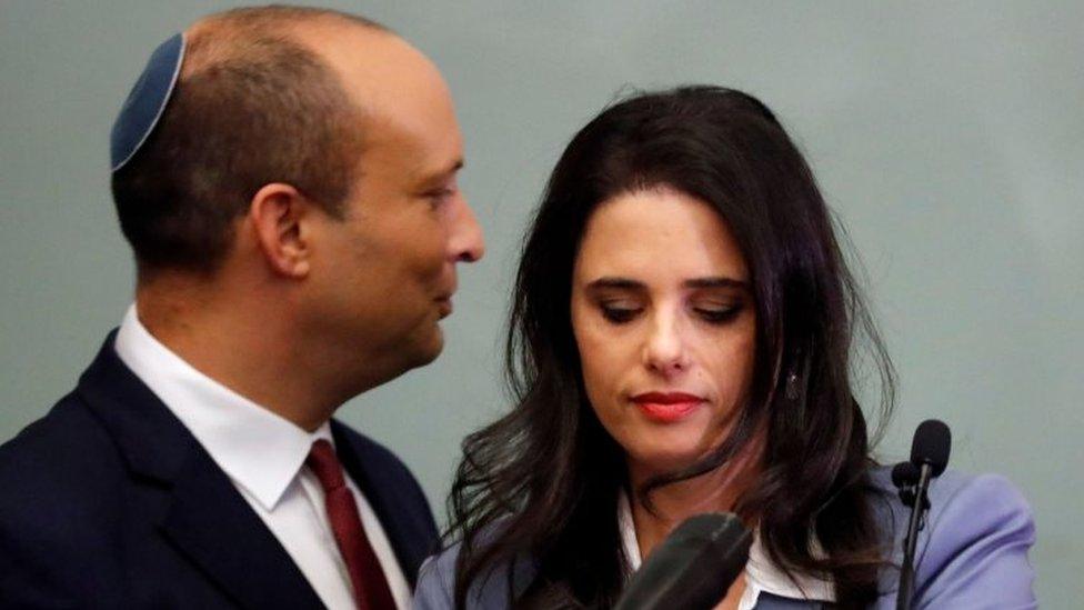 Israeli Education Minister Naftali Bennett (L) and Justice Minister Ayelet Shaked (R) are seen together as they give a statement at the Knesset in Jerusalem on 18 November 2018.