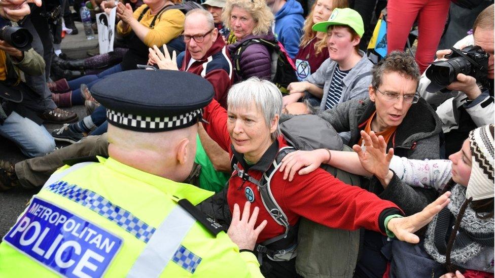 Police officer talks to protesters