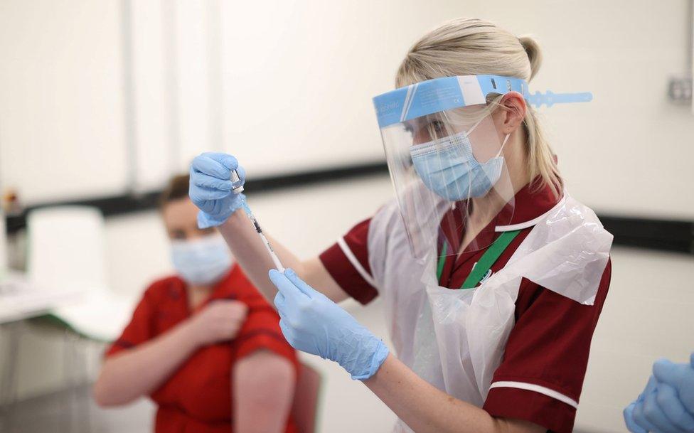 A nurse preparing a Covid-19 vaccine