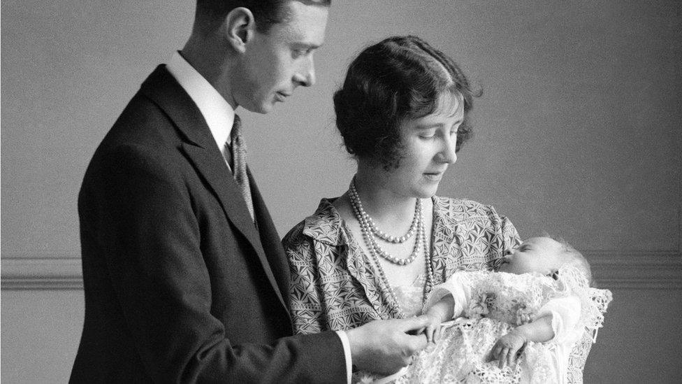 The Duke and Duchess of York hold their daughter Elizabeth, who would become Queen Elizabeth II